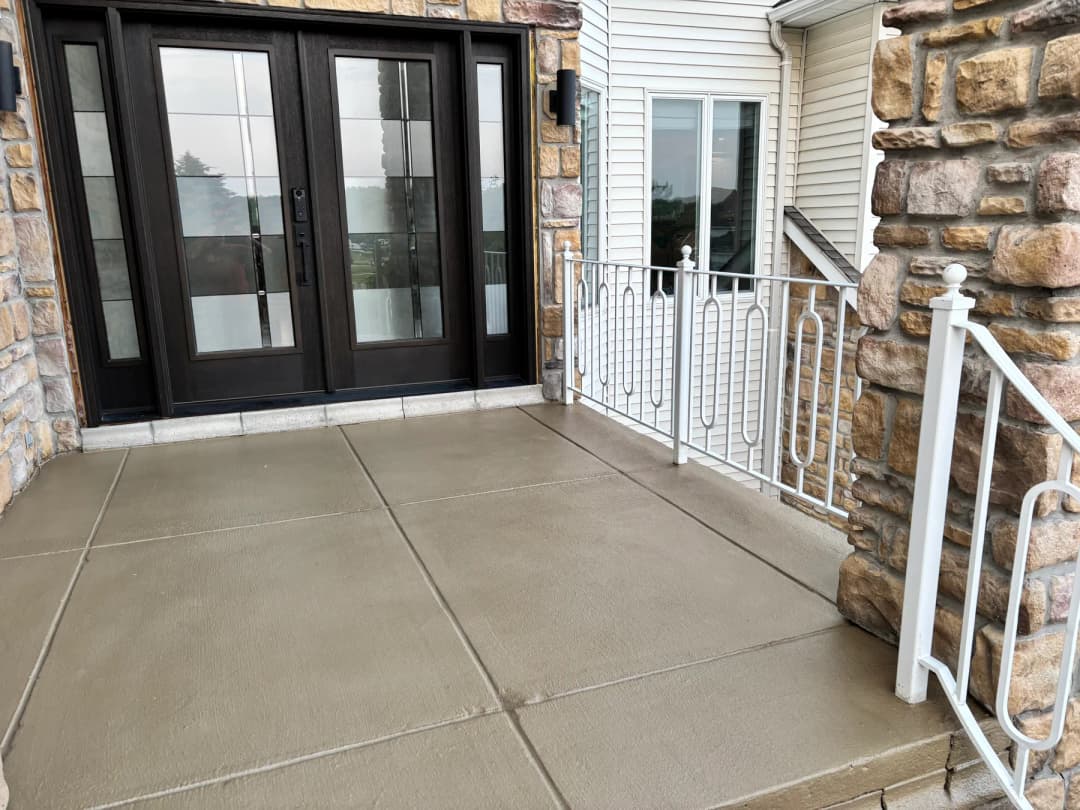 Finished front porch concrete overlay and entry landing near Buffalo NY