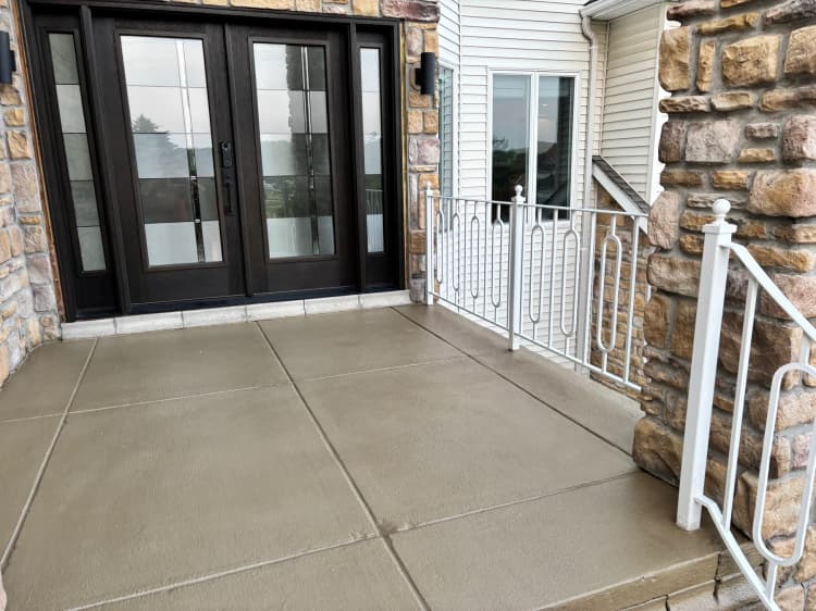 Finished front porch concrete overlay and entry landing near Buffalo NY