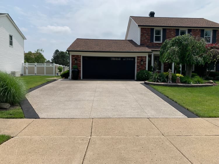 Finished residential driveway concrete repair and clean edging near Buffalo NY