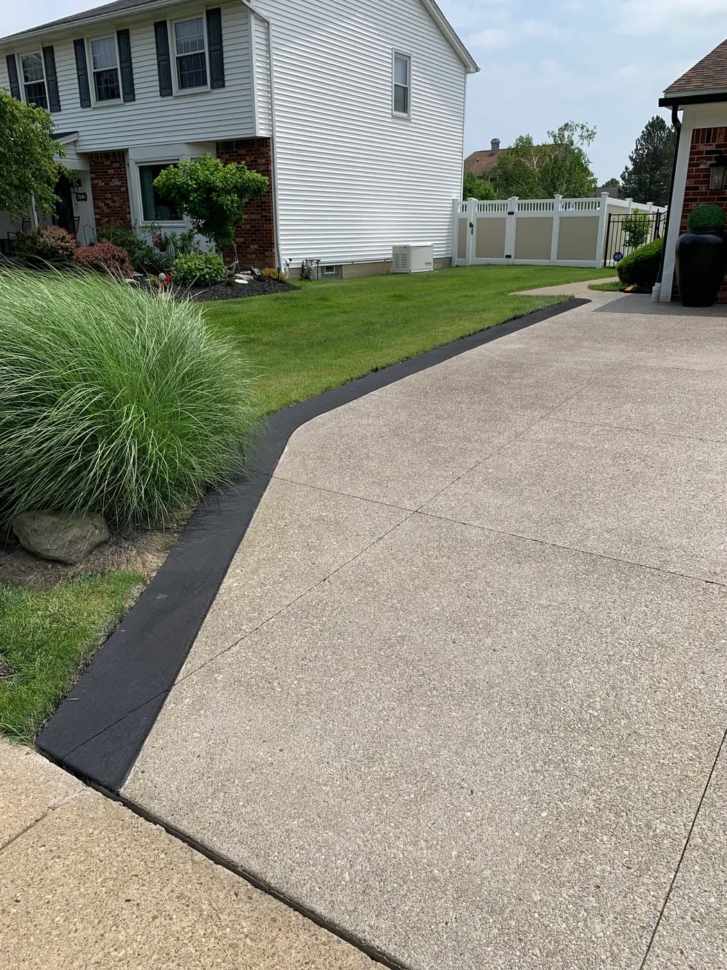 Residential driveway concrete edging and surface repair in Western New York