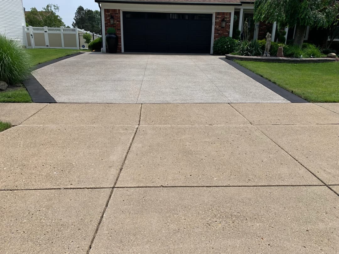 Close view of repaired and resurfaced residential concrete driveway near Buffalo NY